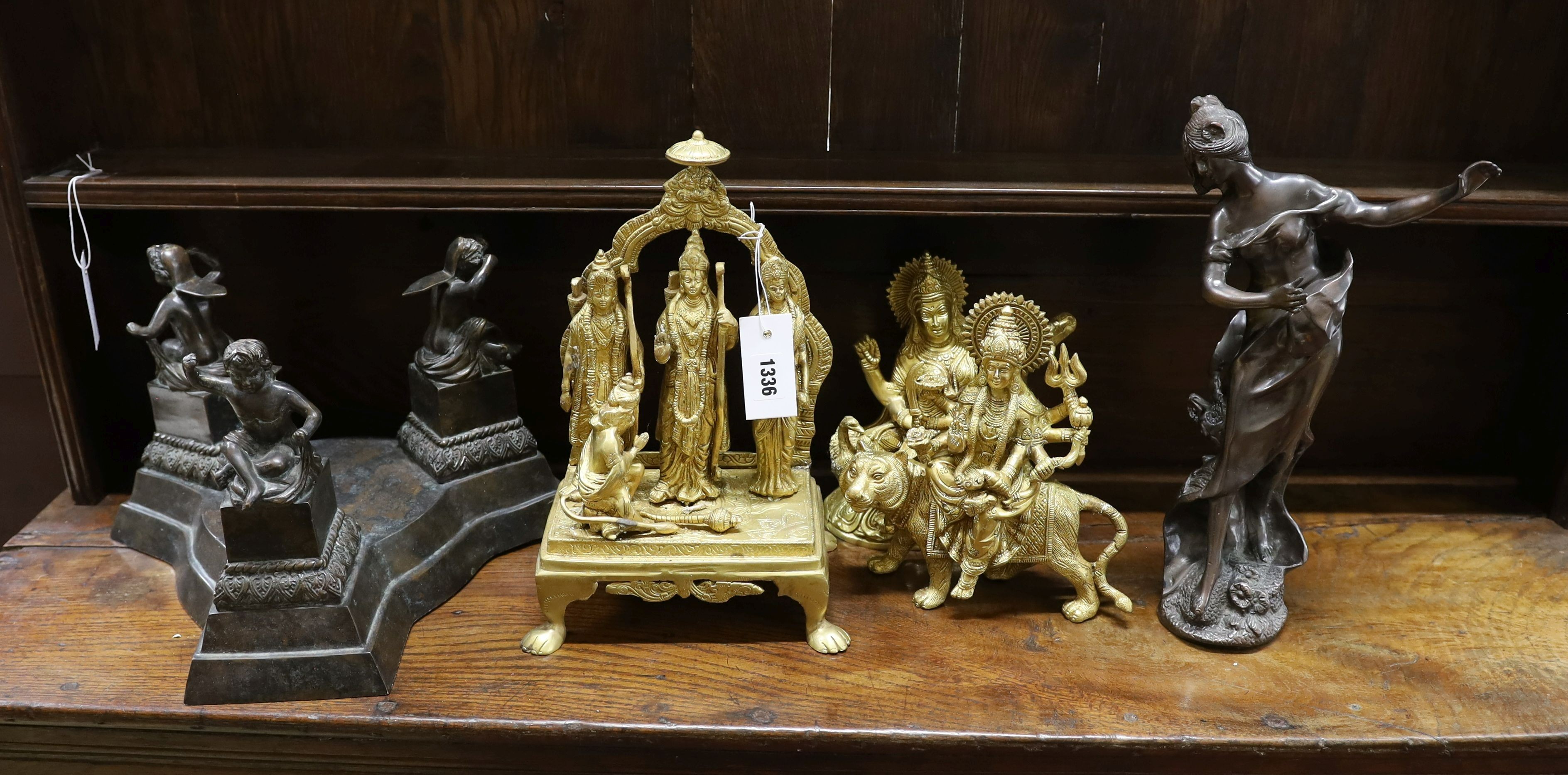 Three gilt metal deities, a faux bronze figure and one other, largest height 37cm